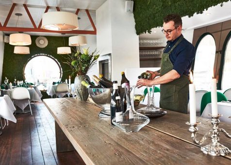 Restaurant viva bartender pouring wine