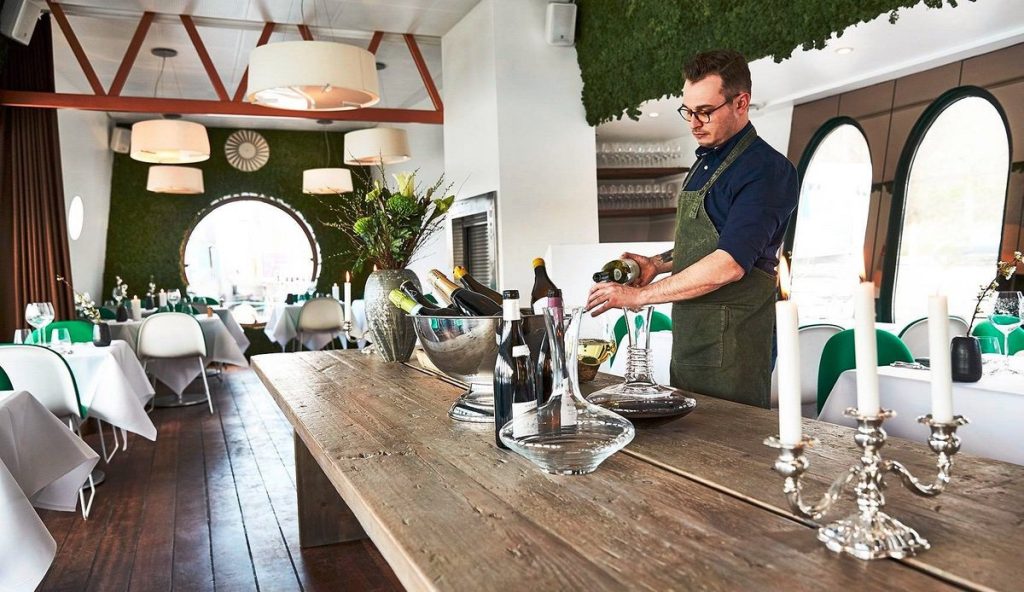 Restaurant viva bartender pouring wine
