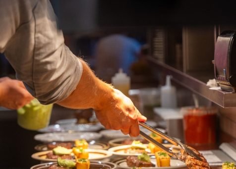 Momo Grill Vilnius in the kitchen preparing food for a group