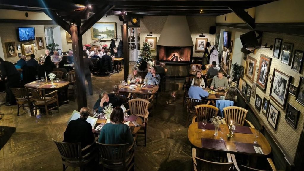 Old Green House in Vilnius interior with people