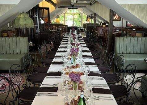 Old Green House Vilnius set up for group dinner in third floor